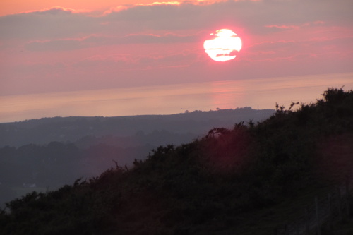 Coucher de soleil sur la mer au Pays basque, tête de femme